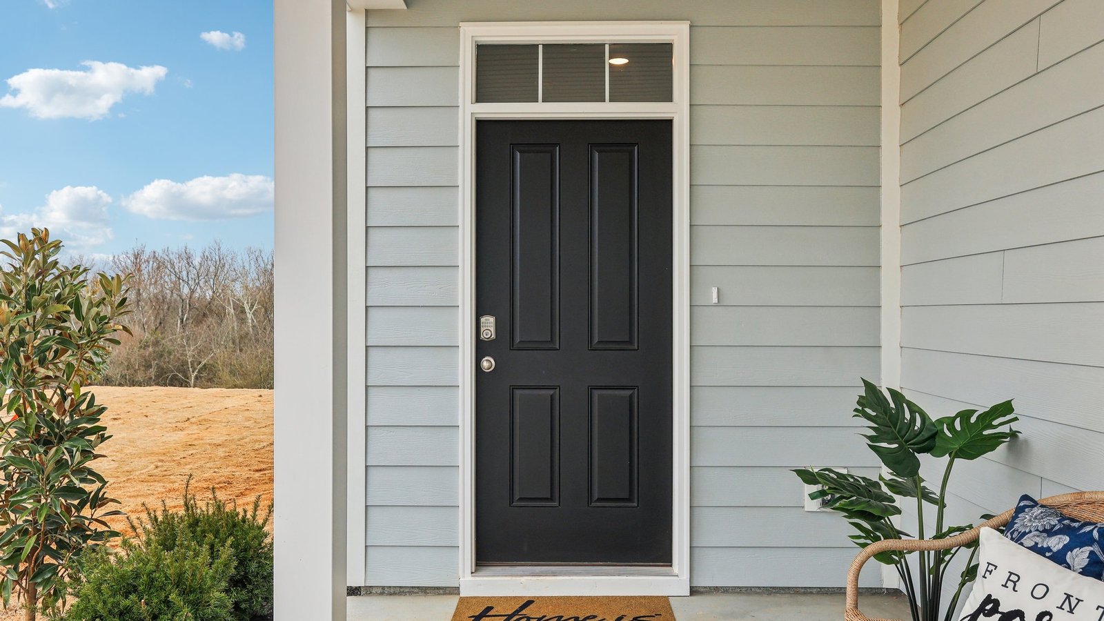 Entry to modern, open concept floorplan