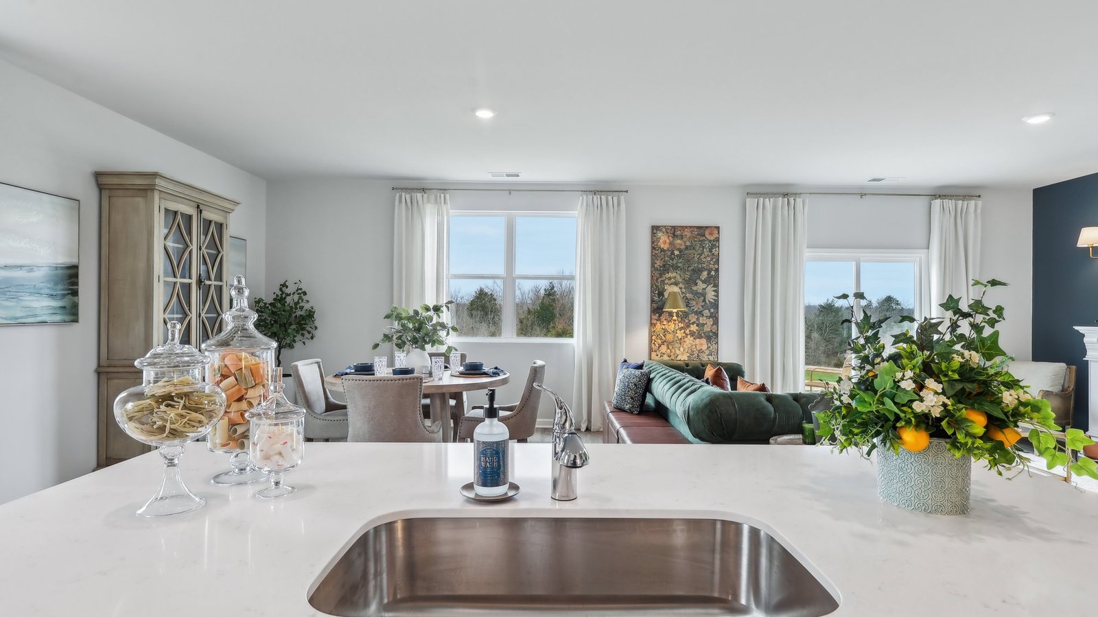 Modern kitchen with quartz countertops and stainless steel appliances