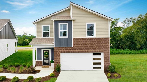 two story new home with beautiful green yard and modern features