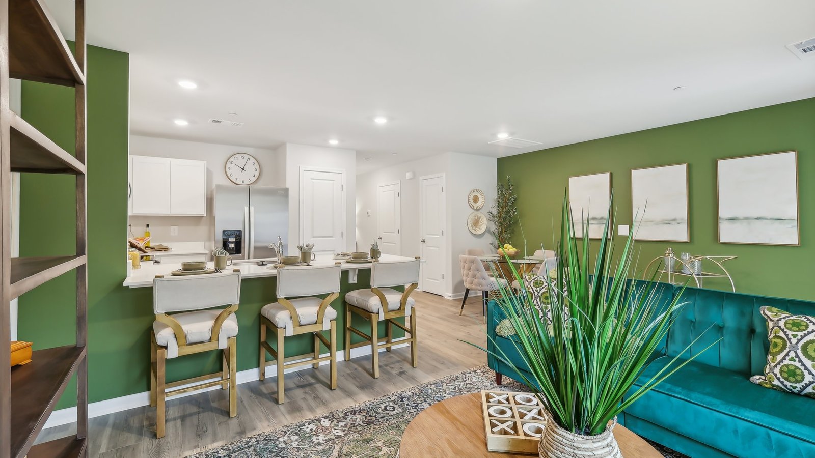 Living room in new, open-concept home with windows and natural lighting