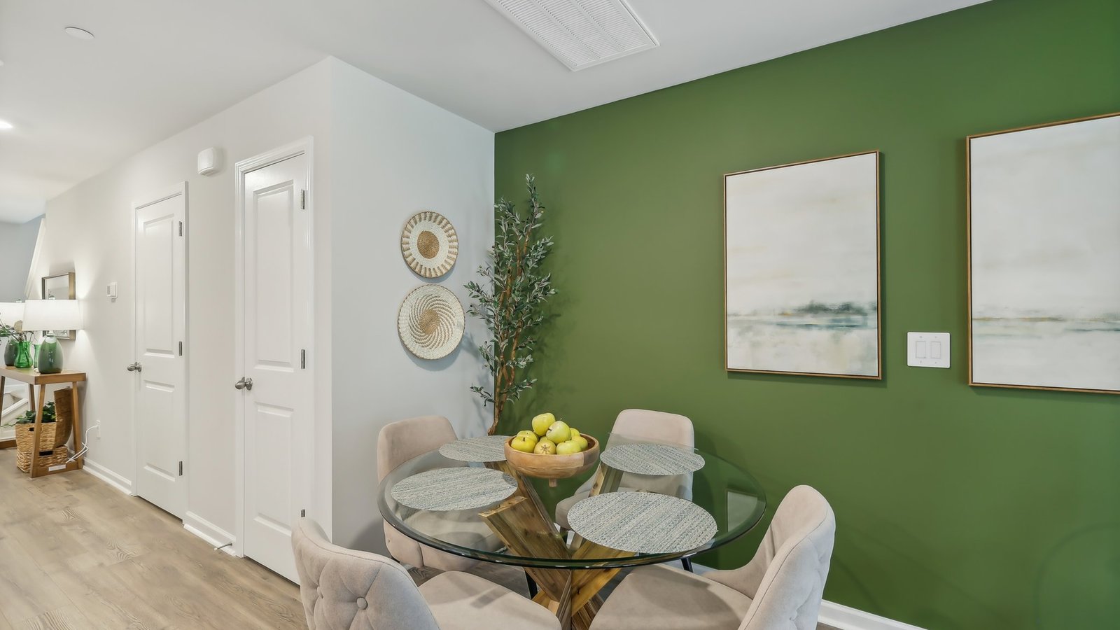 Dining room in new, open-concept home with windows and natural lighting
