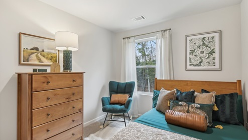 Bedroom in modern, open concept new home