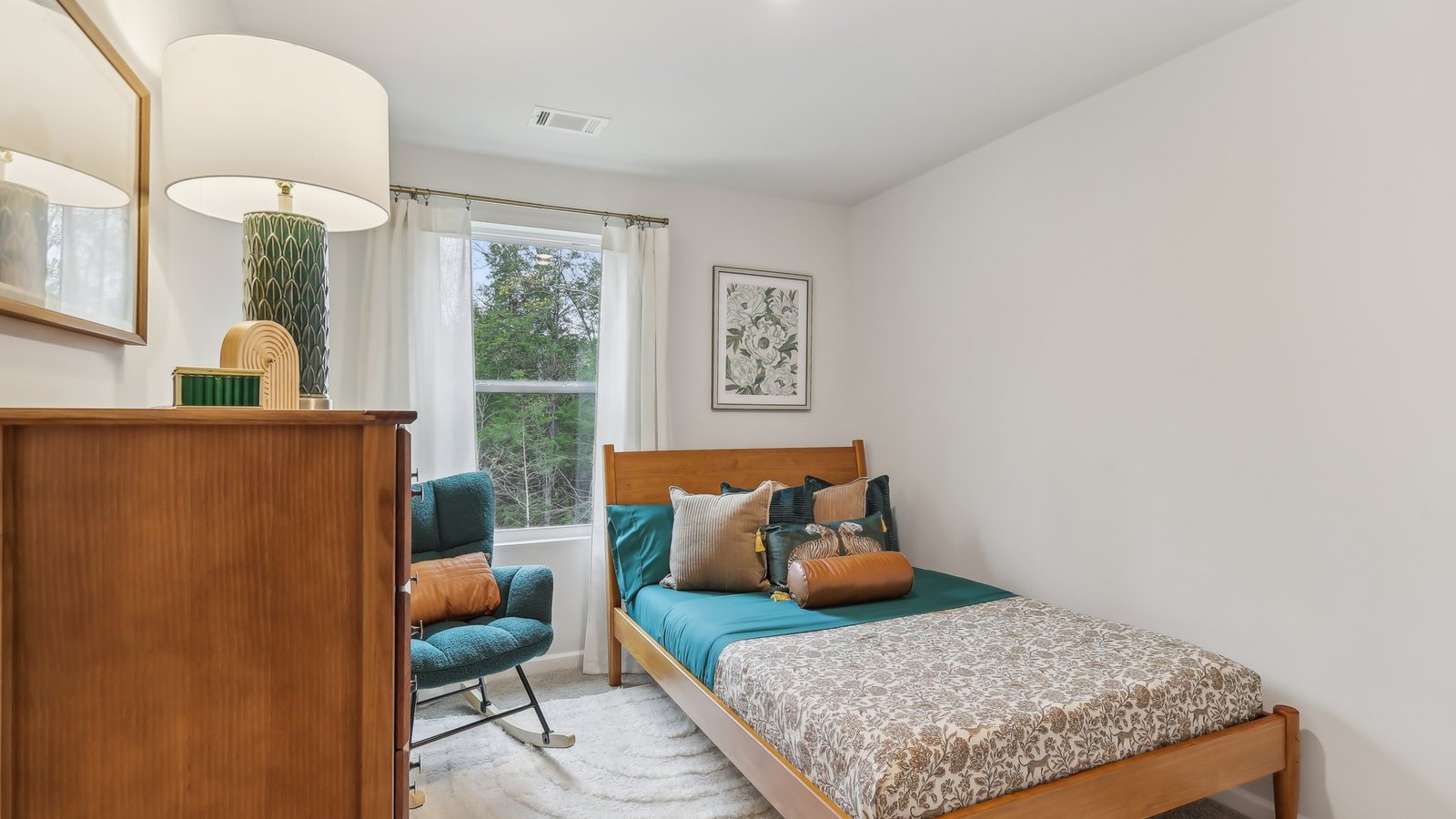 Secondary bedroom with full closet, direct access to shared upstairs spaces, loft multi-use areas Saddle Trace Townhomes