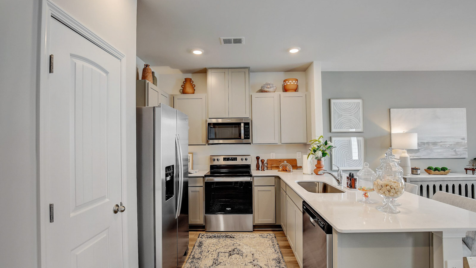 New construction townhome offering a sizeable pantry and cabinet storage making organization optimal in the kitchen