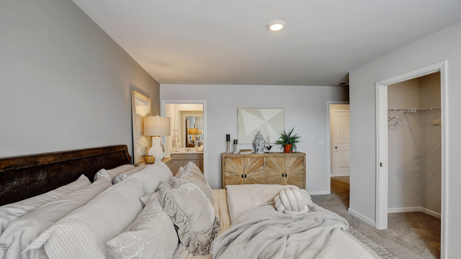 Primary bedroom designed with privacy and space in mind with a flow into a spa-inspired ensuite bathroom and walk-in closet