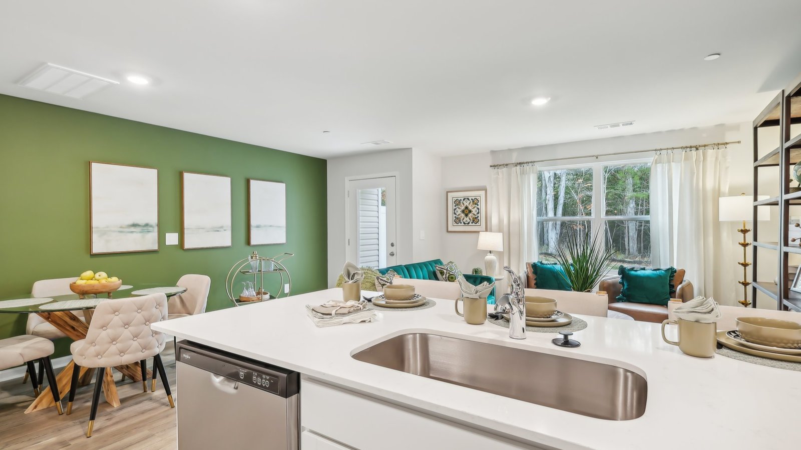 Open concept kitchen wit view of living area and dining area.