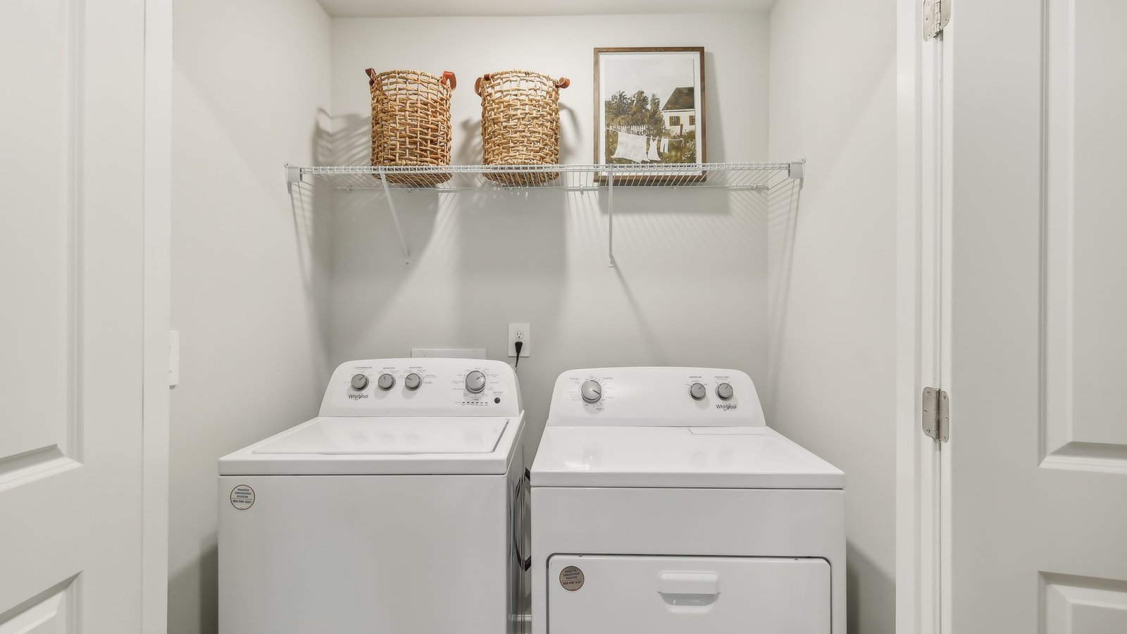 Laundry area with storage space.