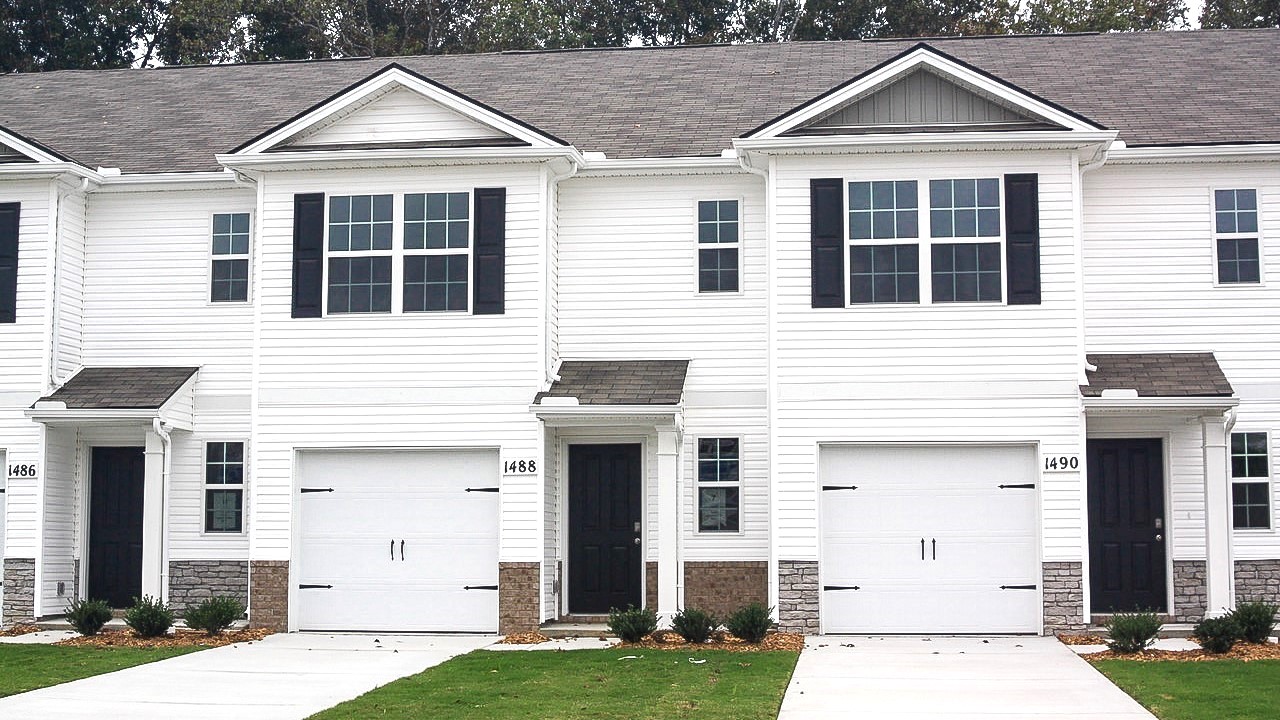 Front exterior with one car garage.