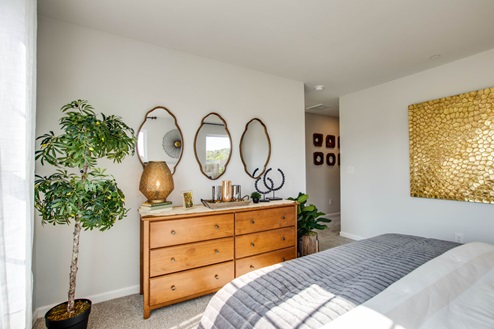 Master bedroom upstairs in open concept floorplan townhome