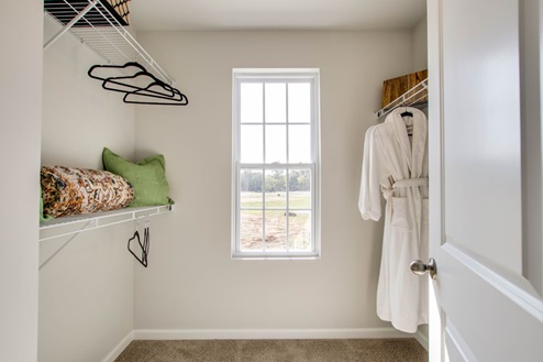 Master closet with quartz countertops in new, modern townhome