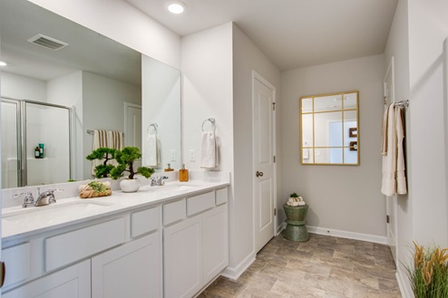 Master bath with quartz countertops in new, modern townhome
