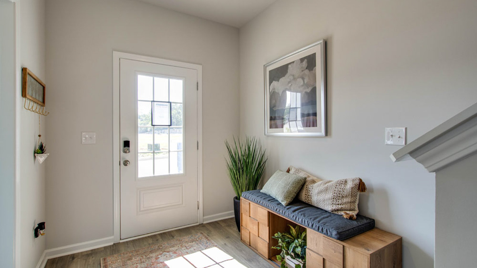 The Front Door of this new townhome adds a with well-crafted and designed living community King’s Landing