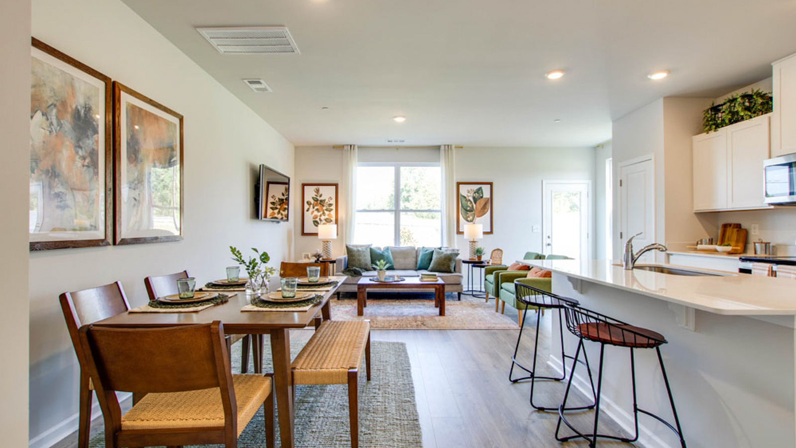View from kitchen to the living room, backyard area, adding our fresh open design at King's Landing