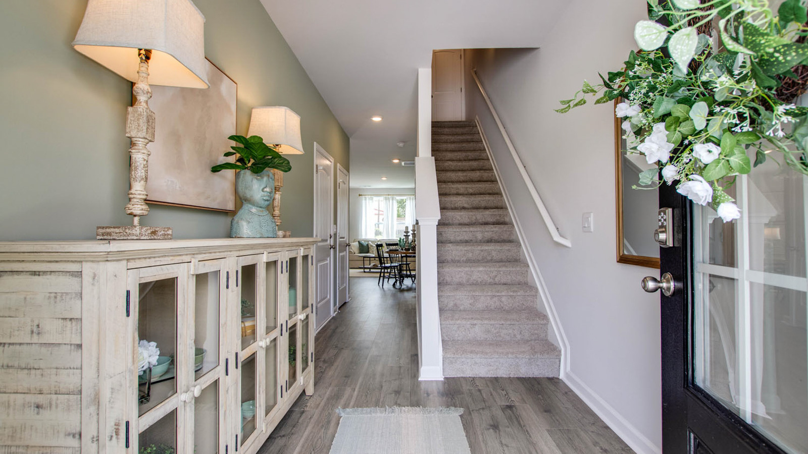 Front Door, foyer entry at the stairs, bringing you home with well-crafted and designed living, dining, kitchen, bedrooms