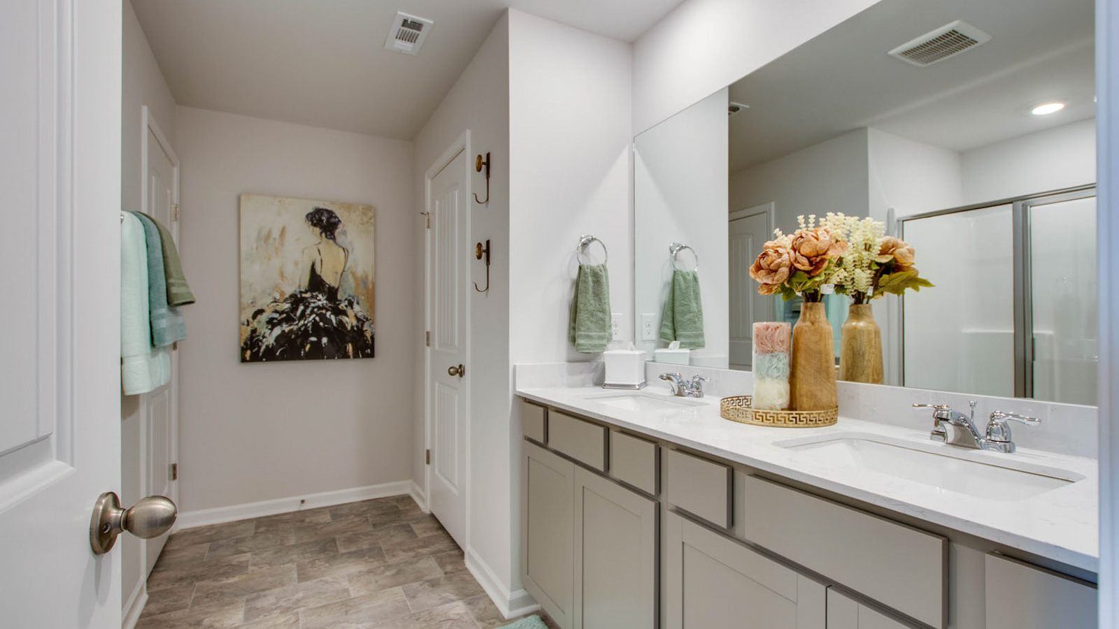 Owner’s ensuite in a new build home offers function and style with a walk-in closet, spa-like ensuite