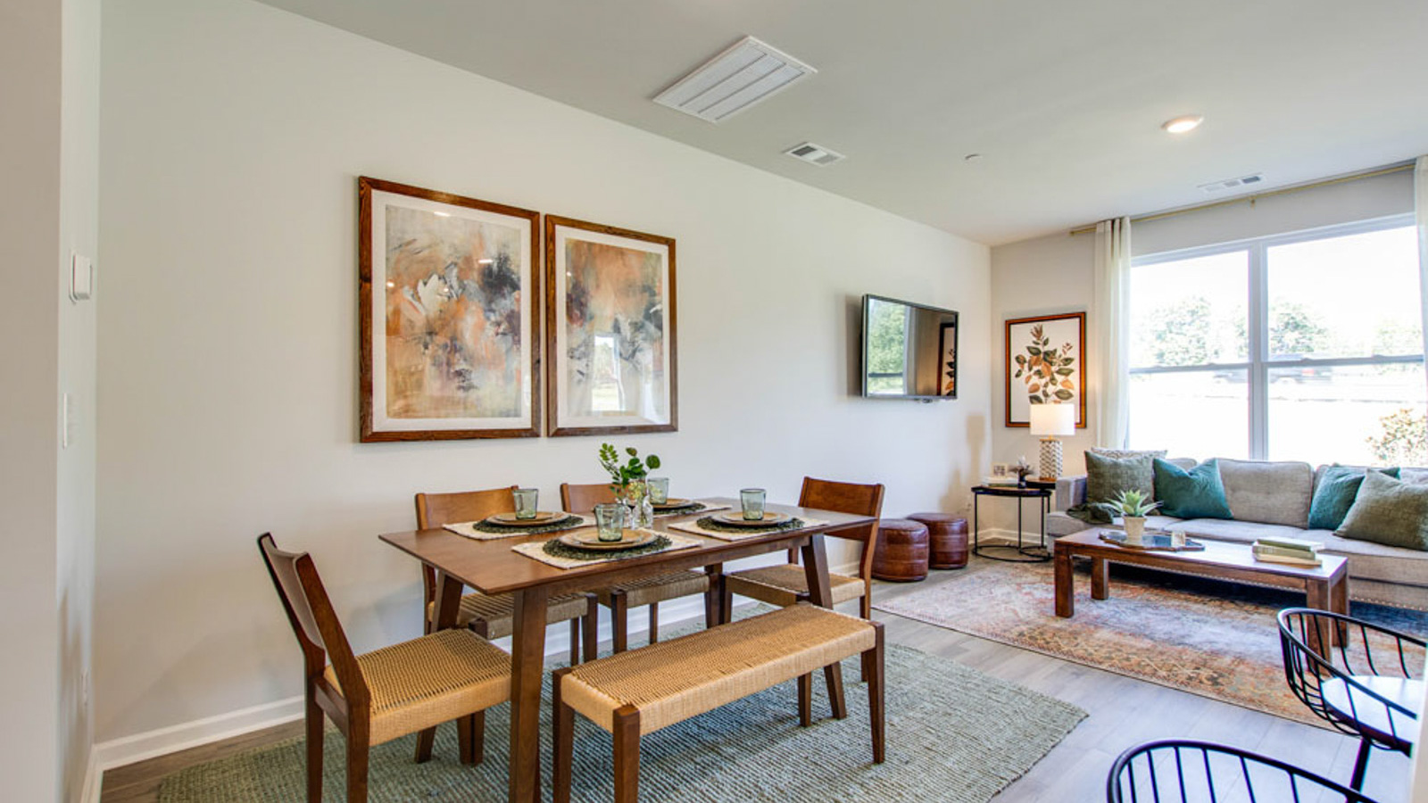 View from kitchen into the dining and living areas, backyard area, showing fresh open design at King's Landing