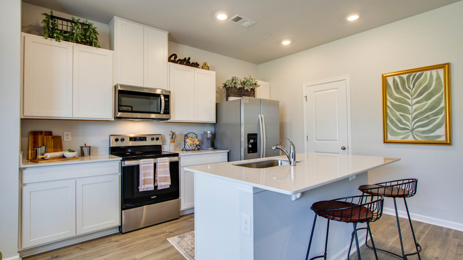 New appliance suite included, our larger kitchen island with seating anchor the kitchen, next to dining, great rooms, pantry