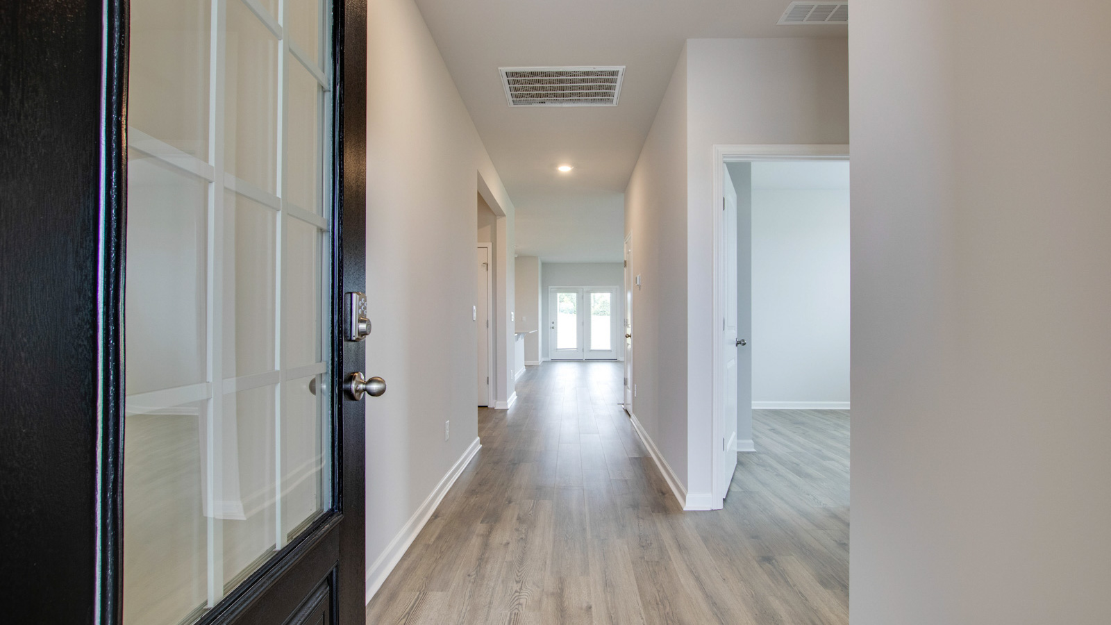 Entry to modern, open concept floorplan