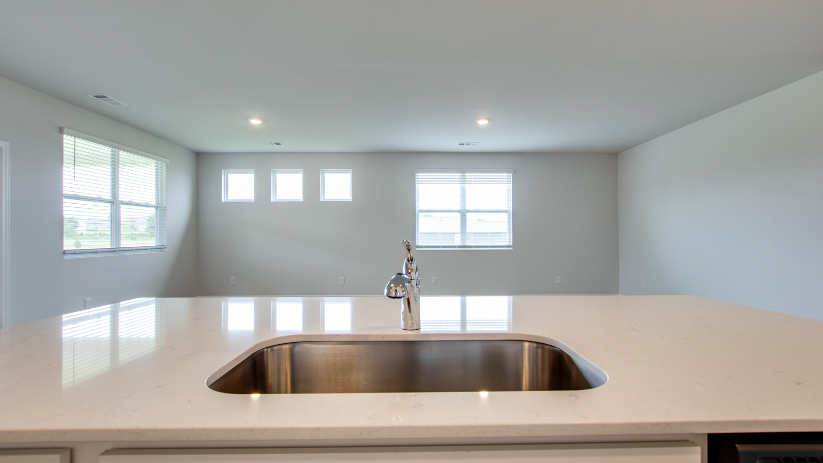 Modern kitchen with quartz countertops and stainless steel appliances