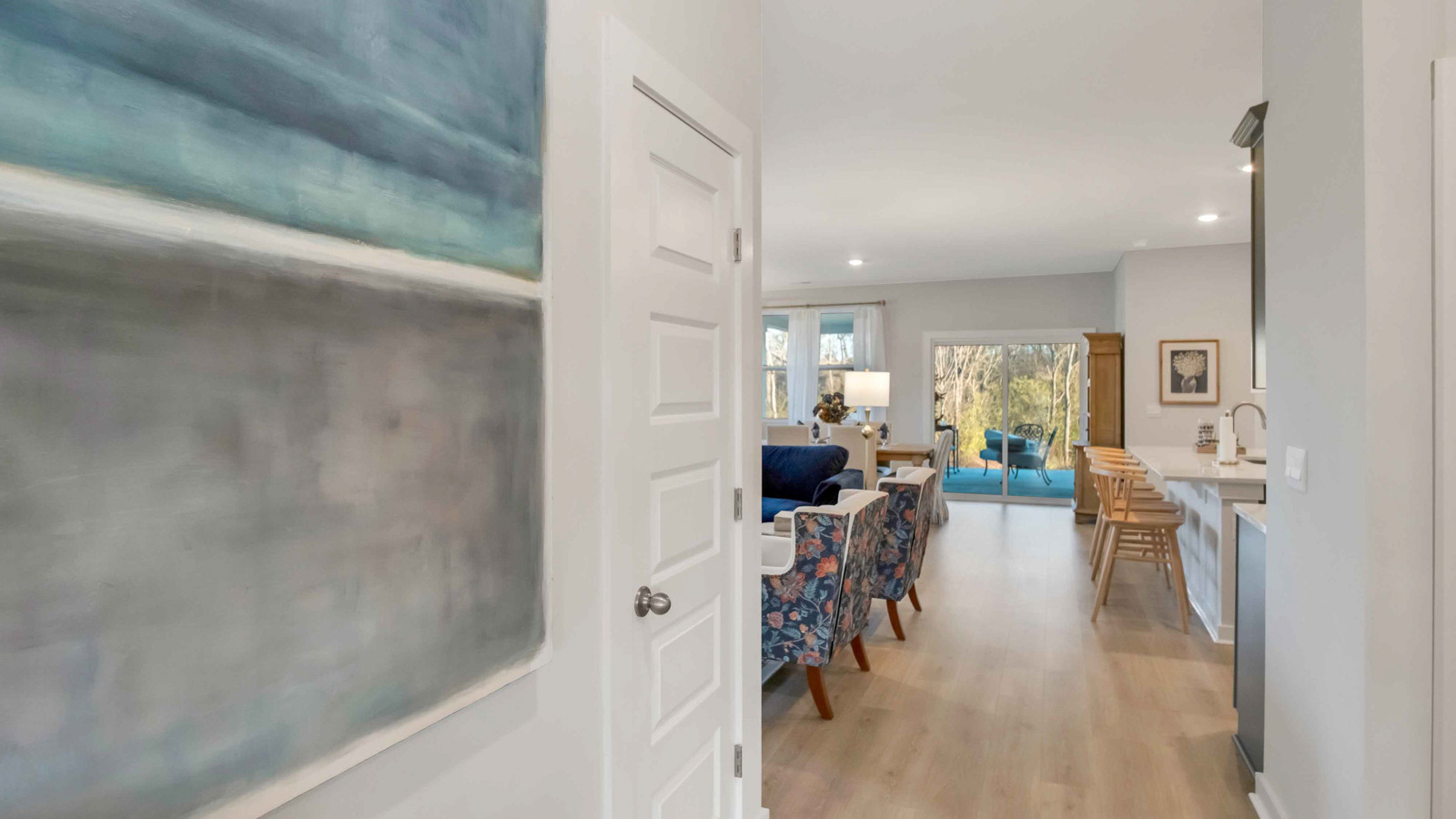 Nexus South garage access, interior of new home inviting you into kitchen, living, dining areas