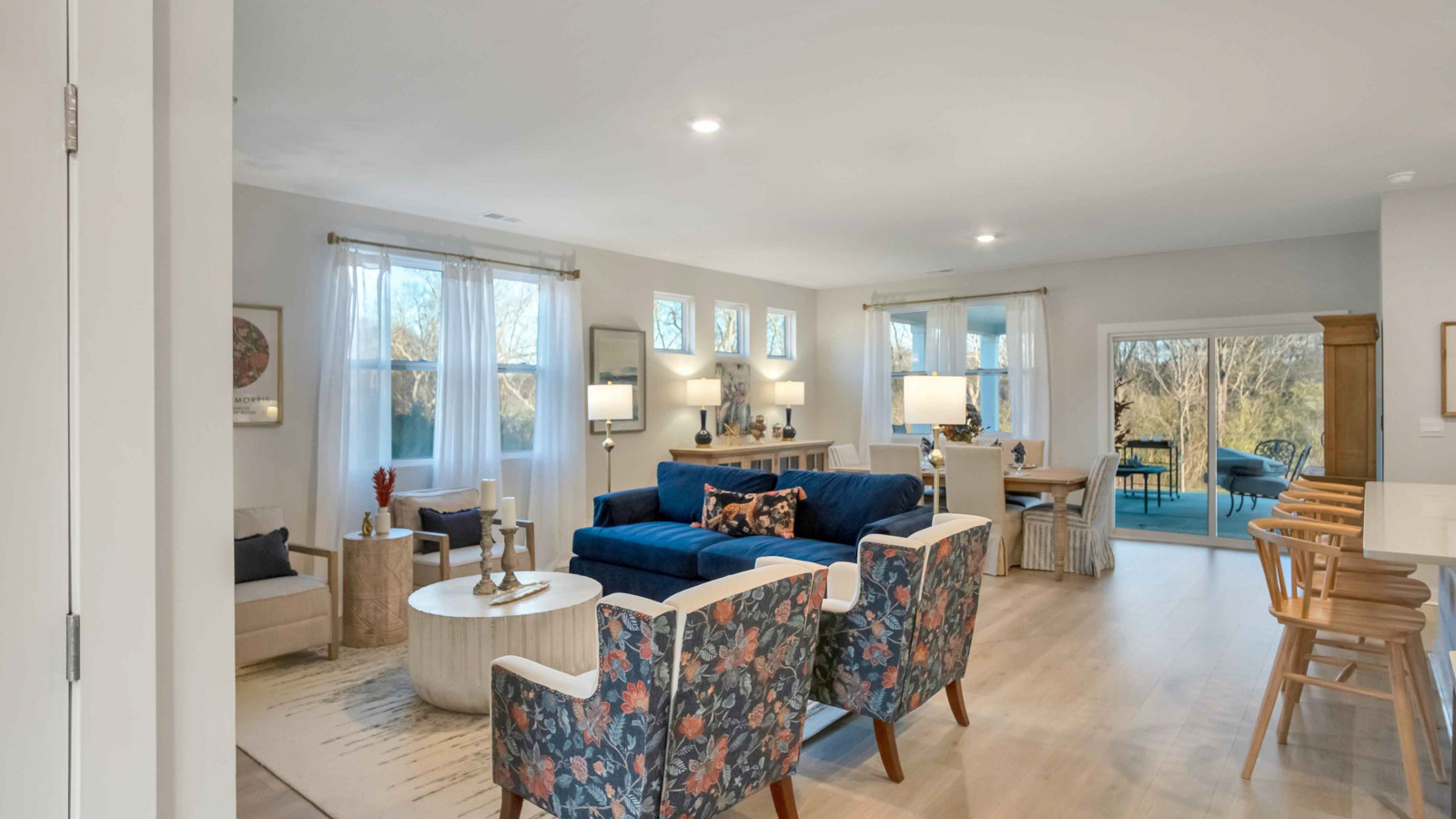 Dining room looking toward modern kitchen island, dining, new appliance suite included at Nexus South