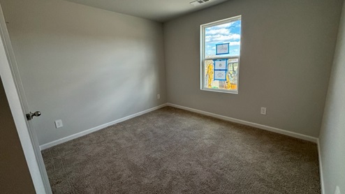 Bedroom in modern, open concept new home