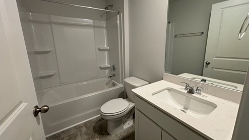 Bathroom with quartz countertops in new home