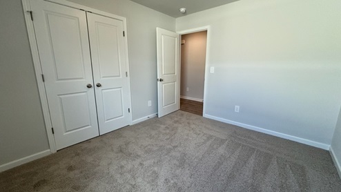 Bedroom in modern, open concept new home
