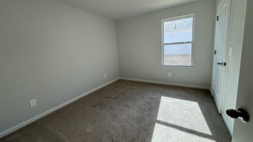 Bedroom in modern, open concept new home