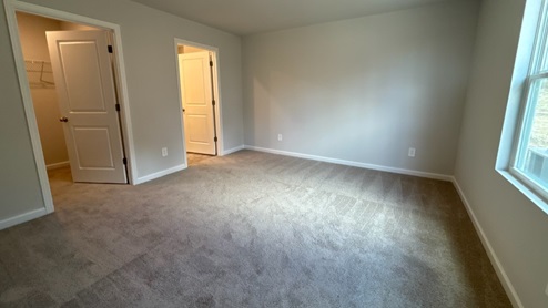 Bedroom in modern, open concept new home