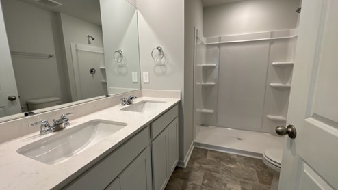 Bathroom with quartz countertops in new home