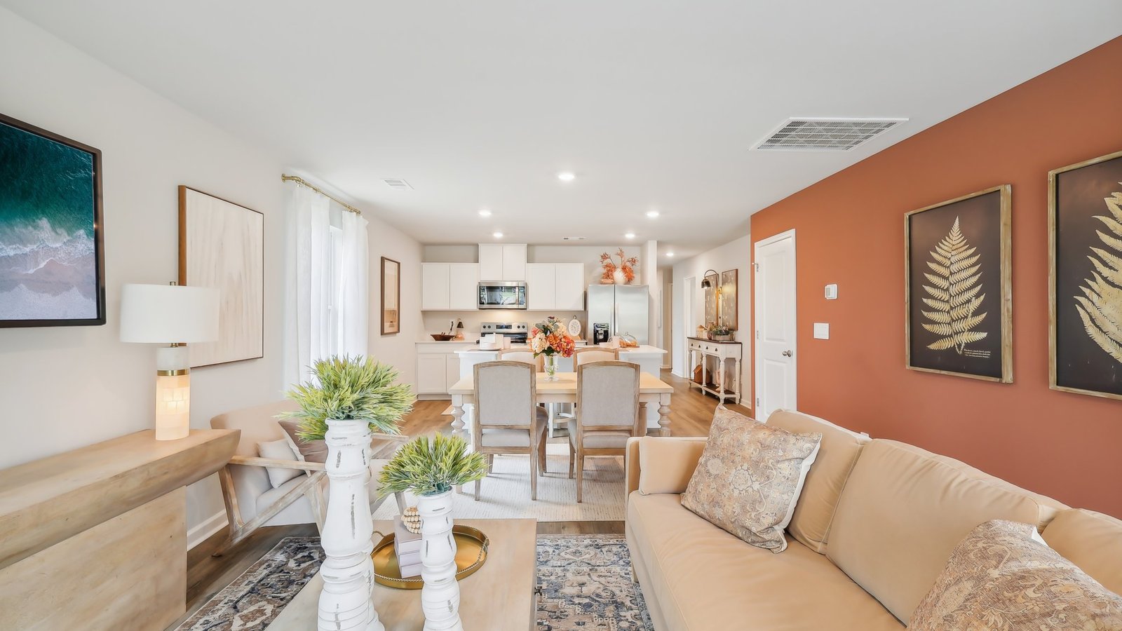 Living room in new, open-concept home with windows and natural lighting