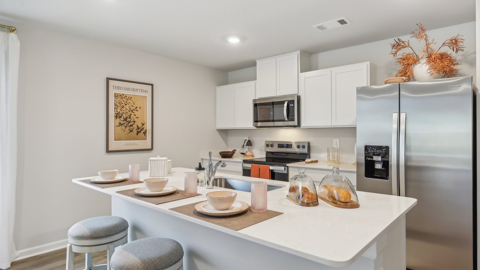 Modern kitchen with quartz countertops and stainless steel appliances