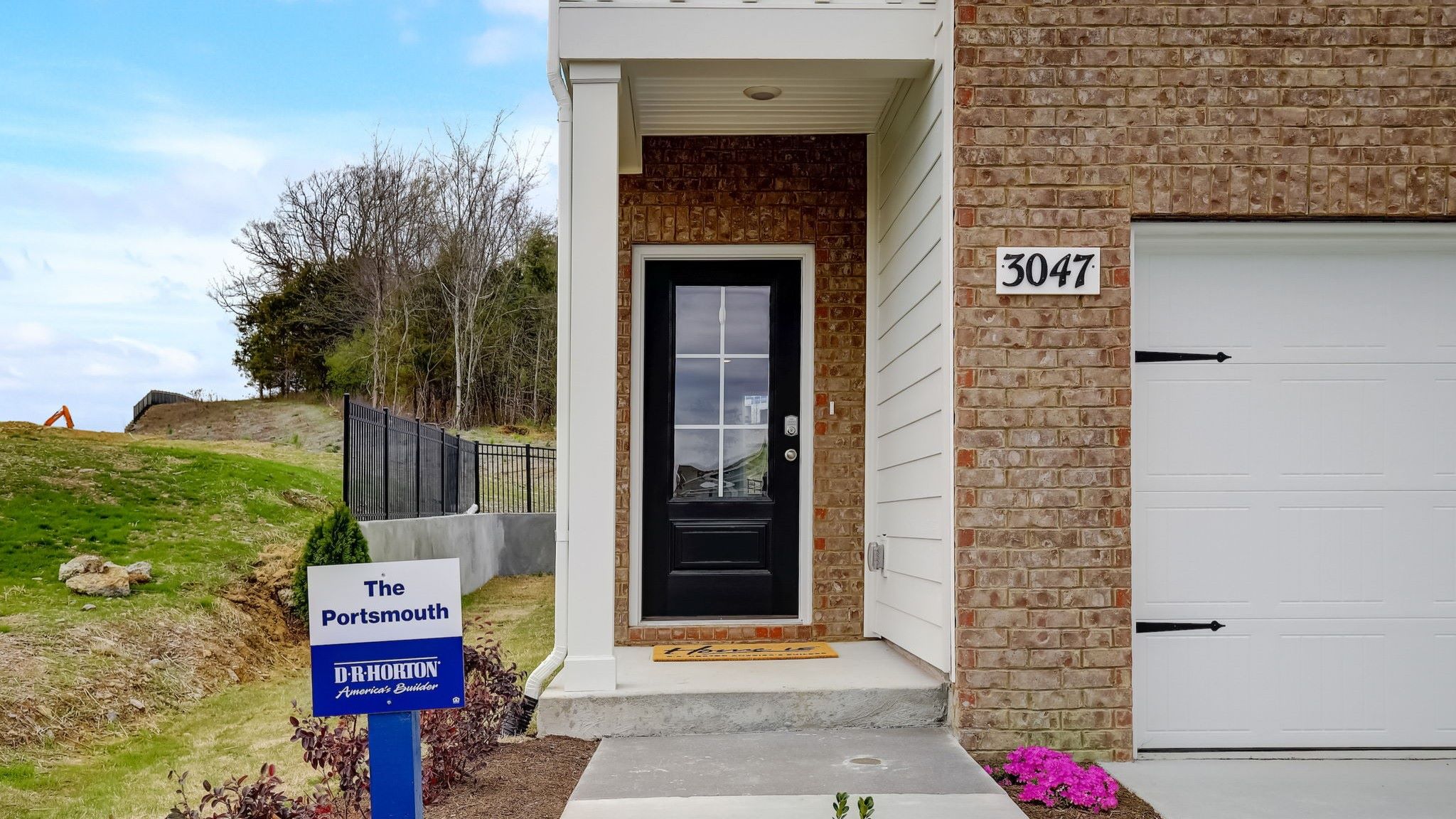 Front door for modern, two story home