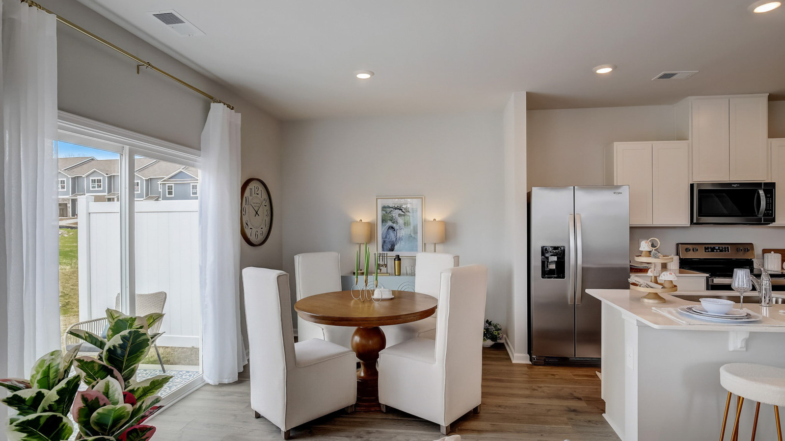 Dining table off of kitchen in two story townhome