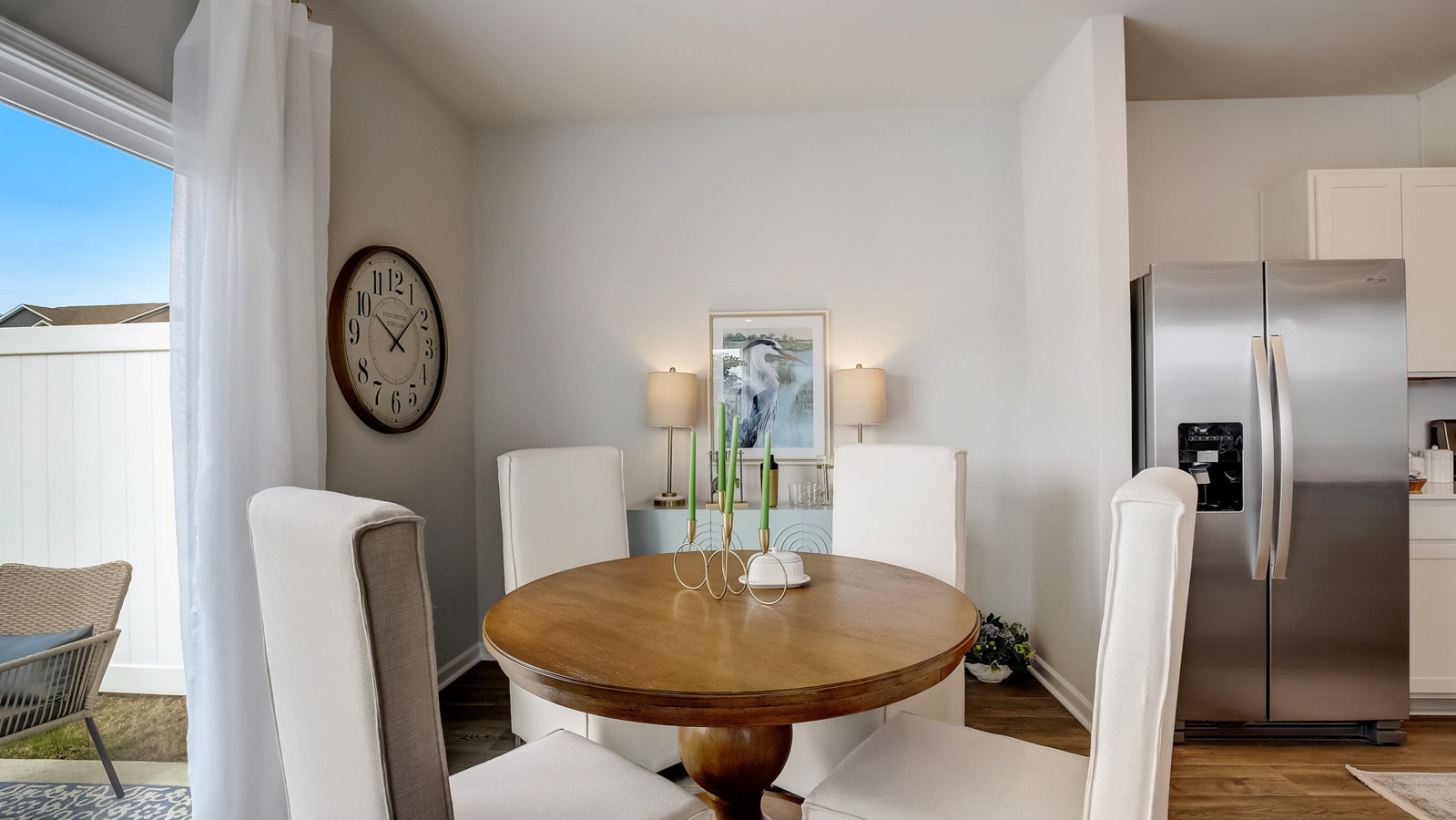 Dining table off of kitchen in two story townhome