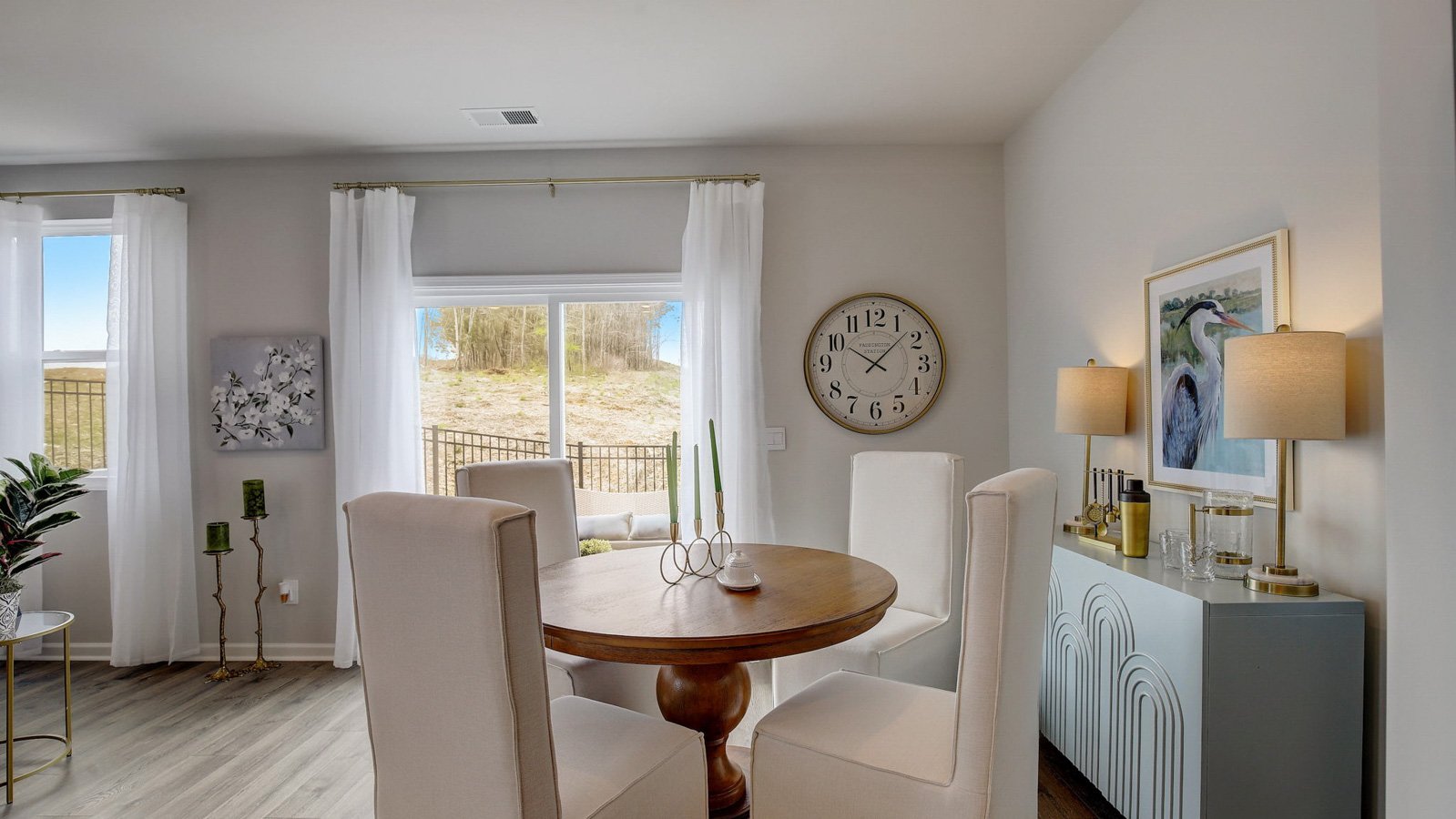 Dining table off of kitchen in two story townhome