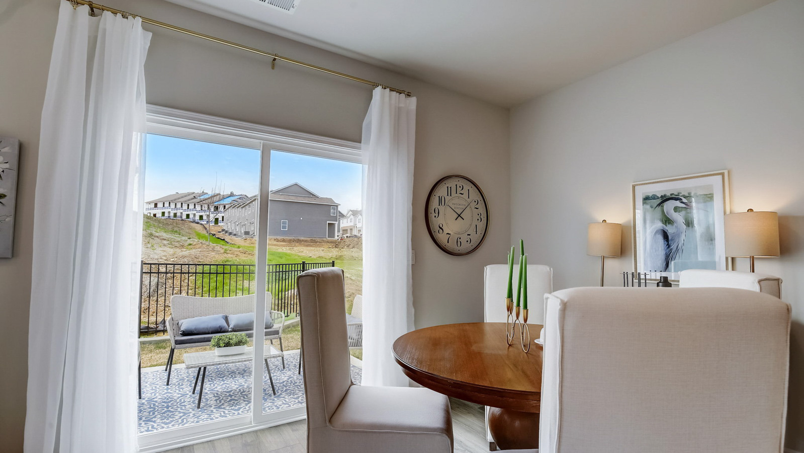 Dining table off of kitchen in two story townhome