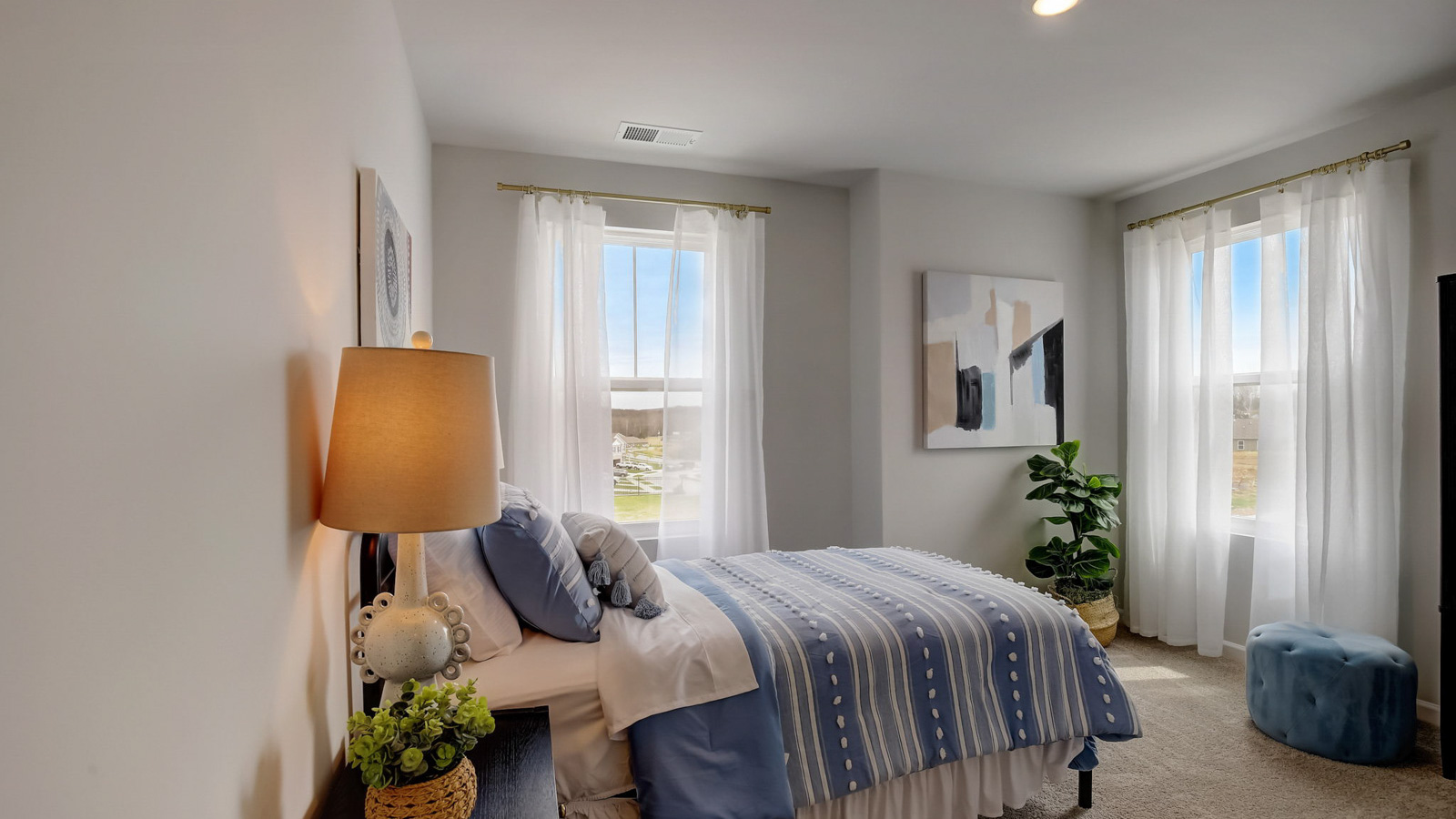 Bedroom in modern, two-story townhome