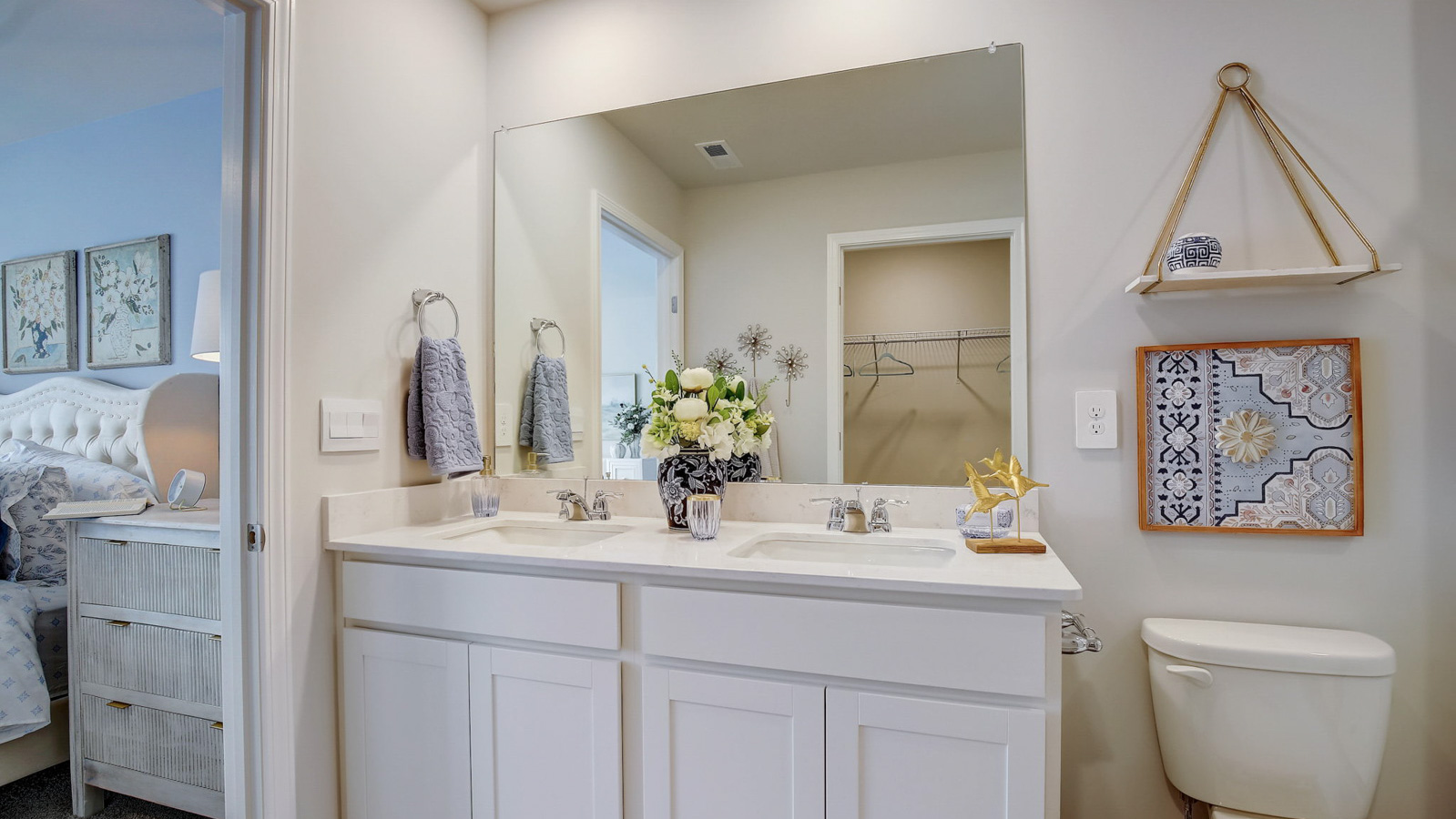 Primary bathroom with quartz countertops in two story townhome