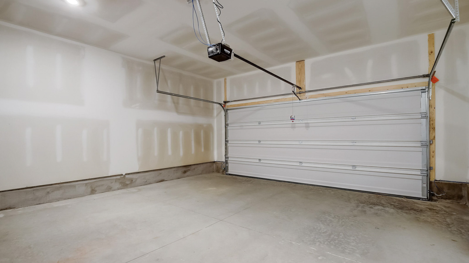 Two car garage in two story townhome with four bedrooms