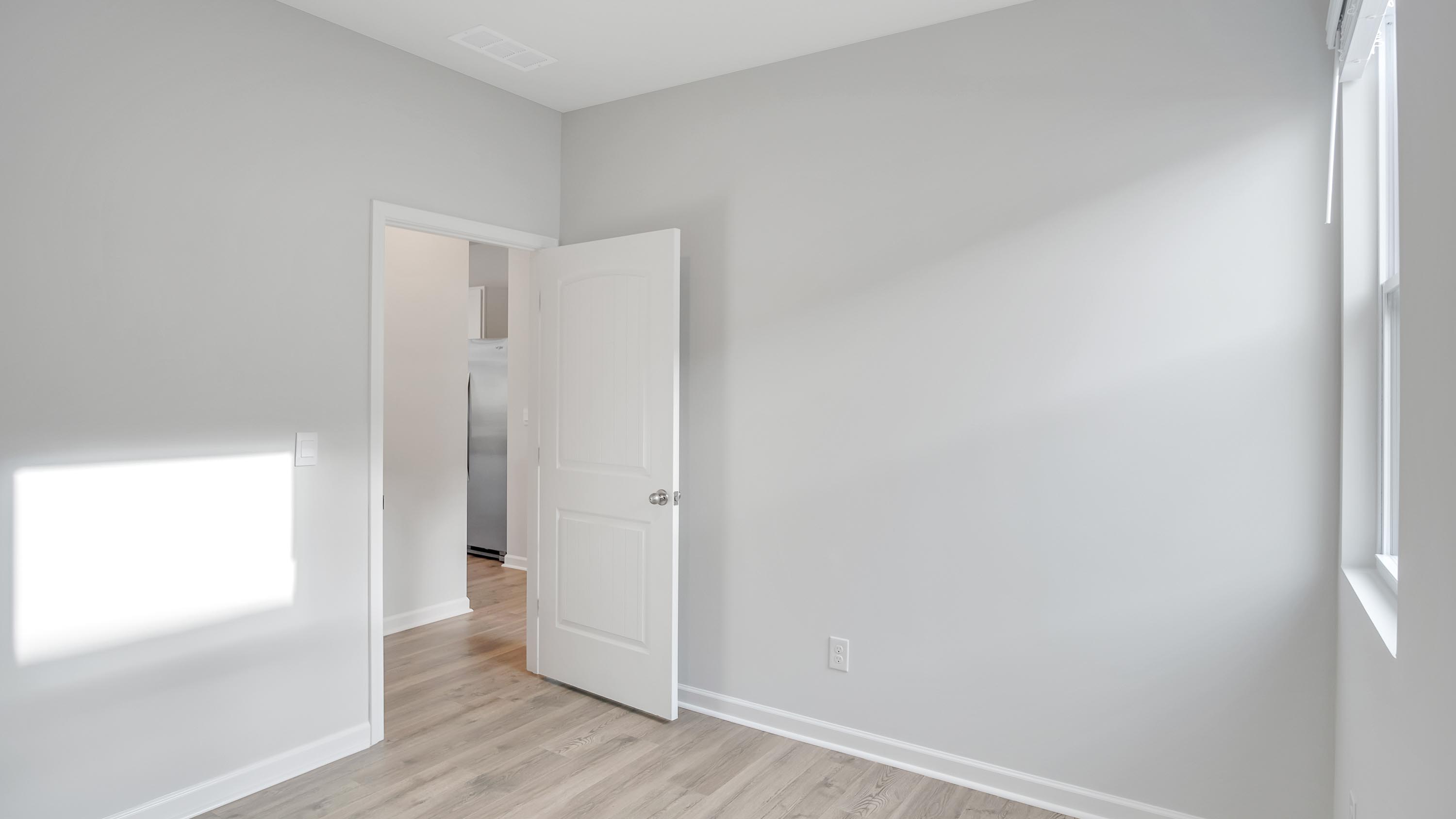 Bedroom in modern, open concept new home