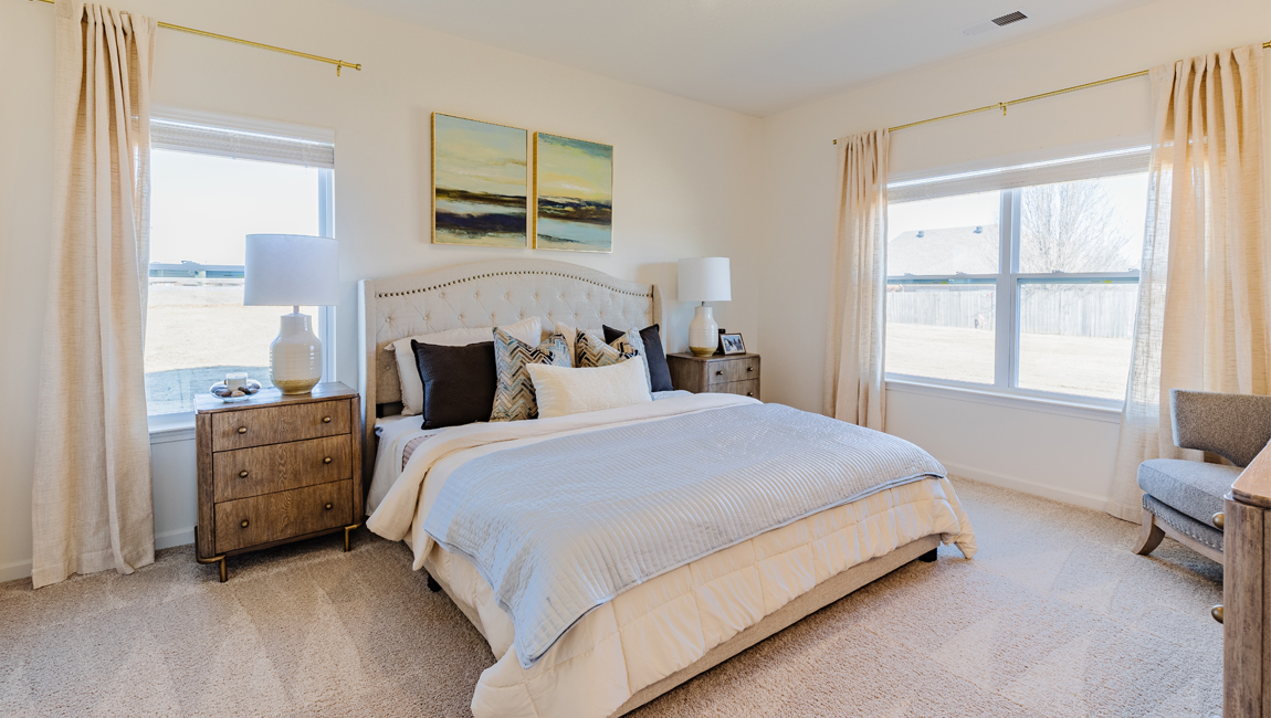 Master bedroom in modern, open concept new build home