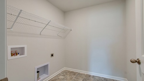 Laundry room in modern, open concept new home