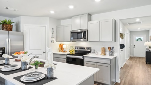 Modern kitchen with quartz countertops and stainless steel appliances