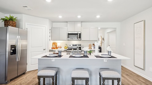 Modern kitchen with quartz countertops and stainless steel appliances
