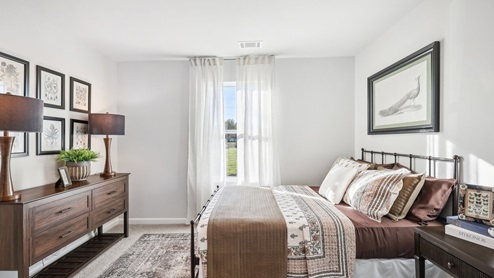Bedroom in modern, open concept new home