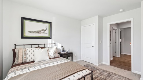 Bedroom in modern, open concept new home