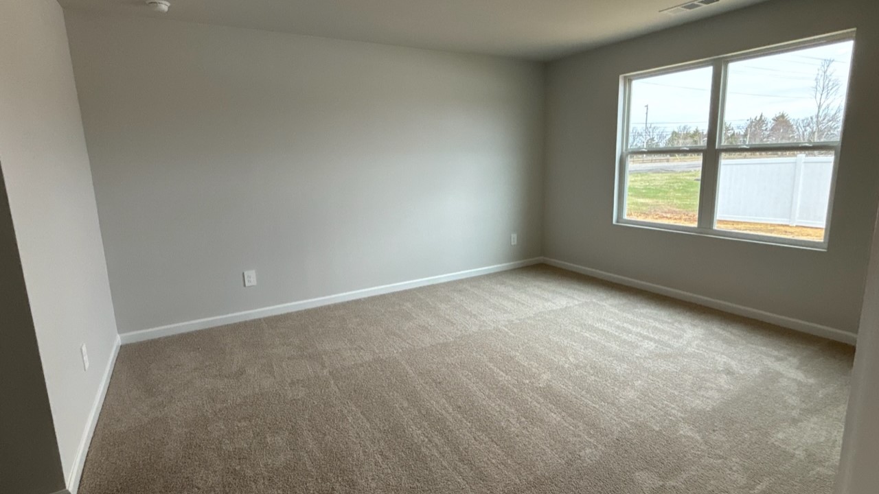 Bedroom in modern, open concept new home