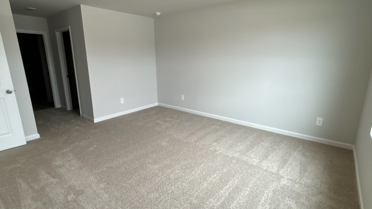 Bedroom in modern, open concept new home